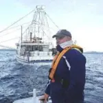 Fisher and fishing boat